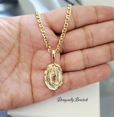 14k Gold Layard & Bonded Virgin Mary Necklace, Religious Necklace, for Women, Men Made of 14k Gold Layered and Bonded Over Semiprecious Metal. High Quality Necklace, Will Not Fade Maritime Style Chain is 3mm Thick, Flat. Guadalupe Pendant is Solid, 22mm High & 16mm in Width. Beautiful Medium Sized Necklace To care for your jewelry and keep it clean and ready to wear, gently wipe off excess make-up and skin oils after each wearing. Use a nub free, 100% cotton cloth and gently wipe the piece clean Guadalupe Necklace, Maritime Style, Mary Necklace, Virgin Mary Necklace, Name Earrings, Men Boys, Chain Ring, Rope Chain, Virgin Mary