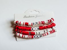 A stack of 5 bracelets.  Please note the mixed colors like red and white will be mixed in at random and may not be placed EXACTLY like this image as well as the the red bracelet.  Made to fit a standard wrist if you would like it to be bigger please request. Trendy White Stacked Beaded Bracelets, Trendy White Stacked Bracelets, Red Stacked Beaded Bracelets For Gifts, Red Stacked Beaded Bracelets As Gift, Adjustable Red Stackable Bracelets, Red Adjustable Stackable Bracelets, Adjustable Red Stackable Stretch Bracelet, Red Adjustable Stacked Bracelets, Adjustable Stacked Red Bracelets