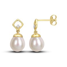 A luscious oval freshwater cultured pearl dangles from each of these splendid earrings. Styled in warm 10K yellow gold, a round diamond sparkles on each setting for a subtle hint of sparkle. The earrings secure with friction backs. Jewel Wedding, Diamond Dangle Earrings, Accessories Jewelry Earrings, Pearl Diamond, Dream Jewelry, Cultured Pearls, Round Diamond, Round Diamonds, Women's Earrings