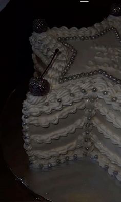 there is a cake that has been decorated with pearls