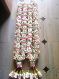 the flowers are arranged in rows on the floor