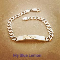 Order any HEBREW or ENGLISH name for your silver bracelet with 14k gold name bracelet!! A great personalized custom made gift for any occasion!! Birthday, Graduation Or Any Holiday! Great Father's Day gift!!*Bracelet is STERLING SILVER!*Name on bracelet is 14K GOLD!*Figaro Style Chain.*2" (inches) bar length*7 mm wide bar*9" bracelet length (can be adjusted by removing links- please let me know the exact length wanted in the note to seller)*Make sure to tell me the name you want in the note to s Gold Sterling Silver Bracelet With Curb Chain, Gold Curb Chain Bracelet In Sterling Silver, Gold-toned Sterling Silver Curb Chain Bracelet, Classic Name Bracelet With Curb Chain As A Gift, Silver 14k Gold Nameplate Bracelet, Classic White Gold Bracelets With Name Detail, 14k Gold Silver Name Bracelet, Classic White Gold Name Bracelets, Classic White Gold Bracelet With Name