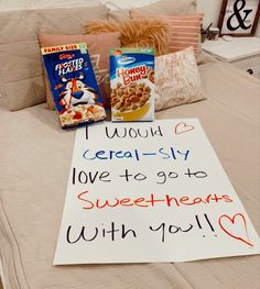 a bed topped with pillows and a sign that says i would cereal - slay love to go sweethearts with you