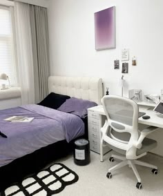 a bedroom with a bed, desk and chair