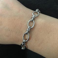 This jaw-dropping, 1/2 inch wide stainless steel bracelet is a show-stopper! Perfect for wearing solo or as part of a layered look. Measuring 7.5 inches long, this accessory is comfy for women's wrists 6.5 inches and under - but if you need a larger size, just reach out! Plus, stainless steel ups the ante with extra durability and a gleam that'll never tarnish! Metal Oval Link Bracelet With Strap Detail, Metal Oval Link Bracelet Strap Jewelry, Hypoallergenic Metal Chain Link Bracelet, Adjustable Metal Chain Bracelet With Oval Link, Adjustable Metal Oval Link Chain Bracelet, Adjustable Oval Link Stainless Steel Chain Bracelet, Hypoallergenic Metal Chain Bracelet With Oval Links, Hypoallergenic Oval Link Metal Chain Bracelet, Adjustable Silver Oval Chain Bracelet