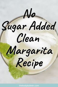 no sugar added clean margarita recipe in a glass with mint leaves on top and the words, no sugar added clean margarita recipe