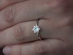 This ring is handmade from 1.5mm sterling silver wire with a 7mm Star of David cameo. The ring is perfect for stacking. Available in a shiny finish (Polished), or a matte finish (Brushed) or an oxidized and brushed finish (for a rustic look). The ring will be sent in a box, ready to be given as a gift. Made to order in your size within 3-5 business days. Ring size can be specified using halves and quarters as I hand make every ring, Sizes can be 2 to 12 With all possible increments in between. W Nickel-free Star-shaped Promise Ring, Adjustable Sterling Silver Stackable Star Rings, Sterling Silver Star Of David Ring Gift, Nickel-free Sterling Silver Star Ring, David Ring, Stack Ring, Stackable Ring, Ring Sizes, Star Of David