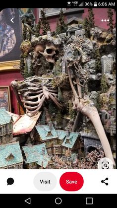 a model of a human skeleton in front of a painting