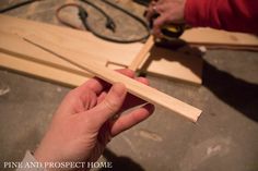 a person is working on something with wood