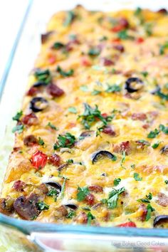 a casserole dish filled with vegetables and cheese