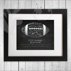 a black and white football print with the names of different teams on it, framed in a wooden frame