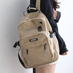 Introducing our Korean Front Pocket Backpack, the perfect companion for students who value style and functionality! This backpack combines a trendy Korean design with ample storage space, making it an ideal choice for school and beyond. Available in five beautiful colors - White, Black, Purple, Red, and Khaki - this backpack lets you express your personal style effortlessly. Whether you prefer a classic and clean look or a vibrant and eye-catching design, there's a color option to suit your tast