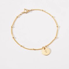 Personalized Small Round Disc Satellite Chain Bracelet-3/8 inch-Initial,Dog Paw, Heart,Symbols-Gold Filled, Rose GF & Sterling Silver-CG309B Personalized this cute and elegant round disc bracelet to make it extra special and meaningful! This dainty and cute bracelet is a perfect bracelet to wear everyday! It's a great gift idea for best friends, bridesmaids, family and yourself! You can personalize with one initial or a symbol on a small 3/8 inch round disc. You can add up to 5 round charms. Coin Anklet, Horizontal Bar Necklace, Butterfly Anklet, Paw Heart, Disc Bracelet, Cute Bracelet, Heart Symbol, Gold Moon, Cute Bracelets