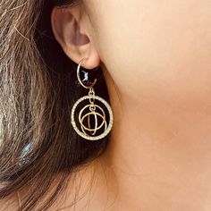 This abstract circles fashion dangle drop earring has a unique statement, features a beautiful crystal stones circles and golden dangle rings which have a nice sound when moving. The design is simple, abstract, modern, and elegant. Wear these fashion statement earrings with your favorite outfit and shine all day long. It's light weight and comfortable to wear. Materials: alloy, rhinestoneFinish: gold color Jewelry Care: See more information about how to care for your jewelry here. Shipping Polic Trendy Alloy Crystal Earrings, Trendy Dangle Hoop Earrings In Alloy, Metal Open Circle Hoop Earrings, Trendy Pierced Metal Crystal Earrings, Trendy Gold Round Crystal Earrings, Metal Round Crystal Earrings, Pierced Round Metal Crystal Earrings, Gold Plated Crystal Earrings, Modern Gold Crystal Earrings