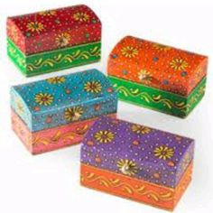 four brightly colored boxes with designs on them