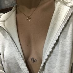 a woman with a small tattoo on her chest