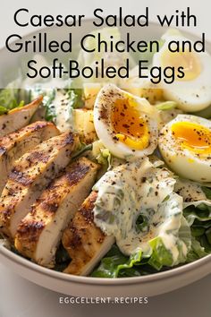 a salad with grilled chicken and soft - boiled eggs in a white bowl on a table