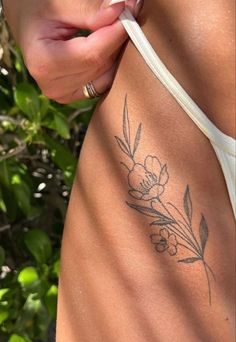 a woman's stomach with flowers on it