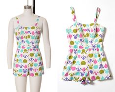 "♡ PLEASE ENLARGE PHOTOS FOR MORE DETAIL ♡ D E T A I L S * 1950s romper * cotton * fruit novelty print * white background with pink, purple, mint blue + olive green * straps attach at back with buttons; 3 buttonholes for adjustable fit; can be tied into a halter * sweetheart neckline * princess seams structured with boning * fitted waist * shorts with attached nylon jersey panty * metal back zipper + hook/eye closure * bodice lined in white cotton; shorts are unlined aside from attached panty * label: no tag present M E A S U R E M E N T S fits like a: x-small bust: 33\" waist: 24/24.5\" hips: 40\" shorts length: 12.5\" bodice length: 15\" (with straps on shortest setting), 15.5\" (with straps on longest setting) inseam: 1.75\" front rise: 13\" (to waist) back rise: 15\" (to waist) leg wid Retro Cotton Jumpsuits And Rompers For Spring, Retro Cotton Fitted Jumpsuits And Rompers, 1950s Romper, White Cotton Shorts, Pastel White, Summer Pins, Womens Jumpsuits, Vintage Swimsuits, Princess Seams