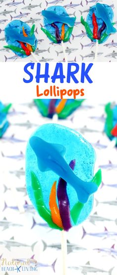 a close up of a lollipop on a stick with the words shark lollipops