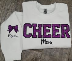 Glitter HTV embroidery combo.  Personalize you colors and name(s) Made with LOVE in Oklahoma.   Gildan unisex crewneck ** Colors are COMPLETELY CUSTOMIZABLE...message me for any changes!  Need cheer GRANNY. COACH, SISTER, etc.... Unisex sizing for a relaxed fit. Suggested sizes: S (0-4) M (6-10) L (10-14) XL (14-18) *Processing TIme* Please allow 5-7 days for production.  We ship USPS, normally allow up to 7 days for shipping. *Care Instructions* Wash inside out, cold.  Lay flat to dry.  Lightly iron if necessary, but NOT over the embroidery  PLEASE! PLEASE! Follow my instructions for best results! Return/Exchange Policy: All sales are final, due to the custom nature.  Please message me with any questions BEFORE purchasing. Cheer Nana Shirt Ideas, Cheer Mom Sweatshirt, Customizable Team Spirit Sweatshirt For Cheerleading, Customizable School Spirit Sweatshirt For Cheerleading, Customizable Cotton Cheerleading Sweatshirt, Customizable Crew Neck Sweatshirt For Cheerleading, Customizable Long Sleeve Cheerleading Sweatshirt, Customizable Cotton Sweatshirt For Cheerleading, Nana Shirts Ideas