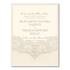 a wedding card with an intricate lace design on the front and bottom, in white