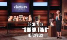 a woman standing in front of a tv screen with the words as seen on shark tank