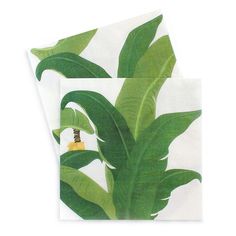 two napkins with green leaves on them, one has a bee in the center