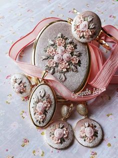 some pink flowers are on top of the purse