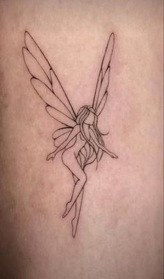 a small fairy tattoo on the back of a woman's thigh, with a black outline