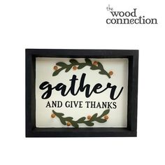 a framed sign with the words gather and give thanks in black lettering on white background