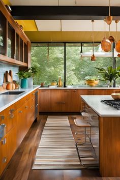 a kitchen with wooden cabinets and stainless steel appliances, along with an area rug that matches the hardwood flooring