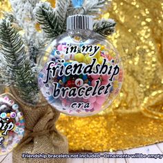 a glass ornament with the words, i'm my friendship bracelet on it