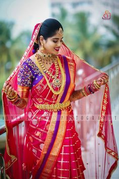 a woman in a red and gold sari