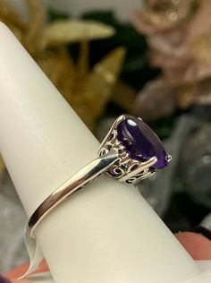 Natural Purple Amethyst Solid Sterling Silver RingK Design#D4 This is a brand-new Victorian design in solid sterling silver. The beautiful trellis filigree of the 5-carat ring is crafted in an amazing vintage style. This full cut sparkling gemstone is 13mm (approximately 1/2") in diameter. The inside of the band is marked 925 for sterling silver. It is a ring that will be treasured as an heirloom. Notice the beautifully intricate design of the silver filigree setting and trellis band. This allur Exquisite Amethyst Ring With Accent Stones, Elegant Amethyst Crystal Ring With Prong Setting, Classic Amethyst Ring With Round Cut, Classic Solitaire Amethyst Ring Gift, Elegant Amethyst Round Cut Ring For Gift, Elegant Amethyst Ring Gift, Round Cut, Elegant Amethyst Crystal Ring With Accent Stones, Elegant Oval Amethyst Promise Ring, Elegant Round Cut Amethyst Ring Gift