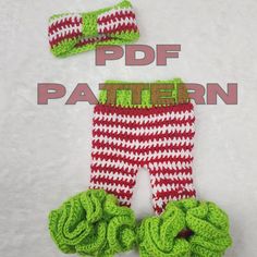 two crocheted baby leggings with green and red yarn