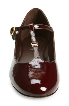 Glossy patent leather reflects the maison's signature romance in a mary jane–style ballet flat finished with understated hardware. Adjustable strap with buckle closure Leather upper, lining and sole Made in Italy Designer Shoes