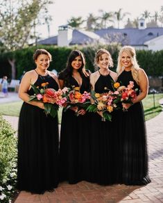 the bridesmaids are all dressed in black dresses