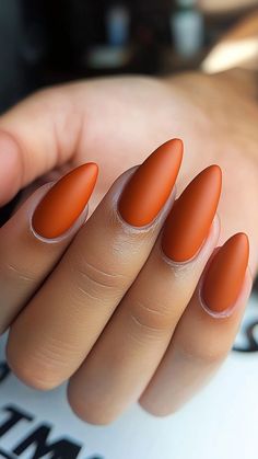 Rusty Orange Matte nails bring a chic, understated elegance to your fall look, perfect for any autumn occasion! This bold yet refined shade will make you the ultimate style icon of the season. Click the pin and follow us for more fall nail inspiration! #FallNails #MatteNails #OrangeNails #AutumnStyle #NailInspo Burnt Orange Matte Nails, Autumn Matte Nails, Orange Nails Autumn, Matte Fall Nails Autumn, Orange Matte Nails, Orange Autumn Nails, Autumn Nails Orange