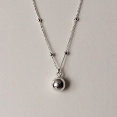 Sterling Silver Satellite Sphere Pendant Necklace sphere pendant dimensions: 8mm wide x 10mm drop material: Sterling Silver. Silver Teardrop Charm Necklace With Clavicle Chain, Minimalist Ball Chain Jewelry Gift, Silver Drop Charm Necklaces With Clavicle Chain, Sterling Silver Pendant Necklace With Ball Chain, Silver Drop Necklace With Clavicle Chain And Round Pendant, Silver Jewelry With Round Pendant And Ball Chain, Sterling Silver Ball Chain Jewelry Gift, Silver Adjustable Drop Necklaces, Dangle Ball Chain Jewelry