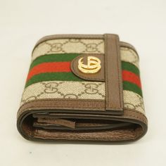 Gucci Bifold Wallet Ophidia 598662 GG Supreme BeigeBrand: GucciGender: WomenLine: OphidiaModel: Bi-fold wallet 598662Colour: BeigeMaterial: GG SupremeSize (HxWxD): 12cm x 11cm x 3cm / 4.72'' x 4.33'' x 1.18'' New Taiwan Dollar, Costa Rican, Gold Ounce, St Helena, North Korean, Colour Beige, Fold Wallet, Bifold Wallet, Scarf Accessory