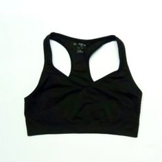 Black Sports Bra. Brand: Danskin Color: Black Size: Xl Material: Nylon & Polyester Smoke Free And Pet Free Environment. Fitted Black Sports Bra With Medium Bust Support, Black Nylon Sports Bra With Medium Bust Support, Black Activewear With Medium Bust Support For Sports, Black Seamless Stretch Sports Bra, Black Nylon Activewear With Bust Support, Black Nylon Racerback Activewear, Black Sports Bra With Medium Bust Support For Running, Black Sleeveless Nylon Sports Bra, Black Sports Bra For Running With Medium Bust Support