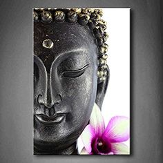 a buddha statue with a purple flower in front of it and an image of the head of a buddha