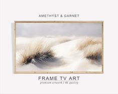 the frame tv art is displayed in front of a white background with grass and snow