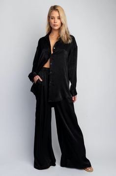 This is an image of Miley Set - RESA featuring a model wearing the dress Black Bottoms For Summer Nights, Black Summer Bottoms For Night, Chic Sleepwear For Date Night In Spring, Chic Black Tops For Night, Chic Relaxed Fit Sleepwear For Lounging, Denim Set, Dress Tight, Collared Blouse, Oversized Long Sleeve