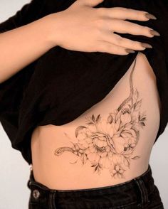 a woman's stomach with flowers on it