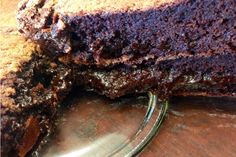 a piece of chocolate cake sitting on top of a wooden table