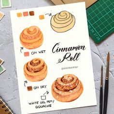 an illustration of cinnamon rolls on a piece of paper next to markers and pencils