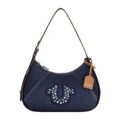 Stylish True Religion Denim Shoulder Bag Studded Embellishment Horseshoe Detail 7" H X 13" W X 4.25" D 10" Strap Drop Zip Closure Adjustable Strap Interior Slip / Zip Pocket Cotton Canvas Exterior/Textile Lining Hanging Logo Tag New And Original With Tag. Item Comes From A Smoke Free Home. Denim Shoulder Bag With Branded Hardware, Denim Shoulder Bag, Tan Shoulder Bag, Denim Crossbody, Weekend Travel Bags, Denim Shoulder Bags, Logo Tag, Denim Bag, Hobo Handbags