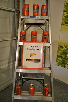 a ladder that has cans on it with the words nerf wars birthday party ideas